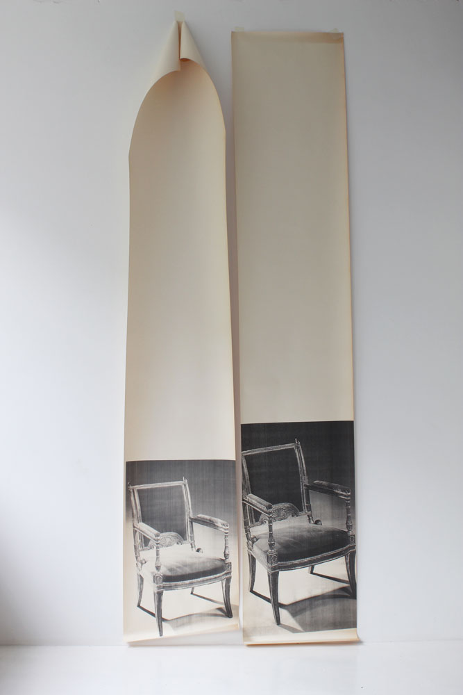 2 drops of wallpaper depicting life size photographic images of old chairs.