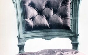 detail of chair a pink wallpaper screen print by Deborah Bowness.